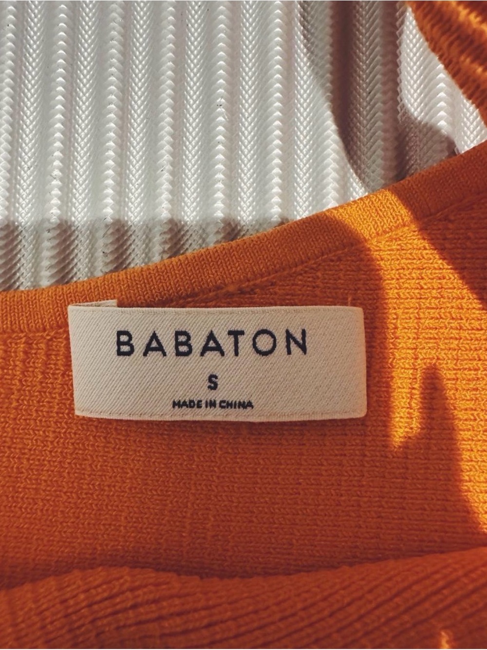 Babaton Orange Ribbed Knit Top